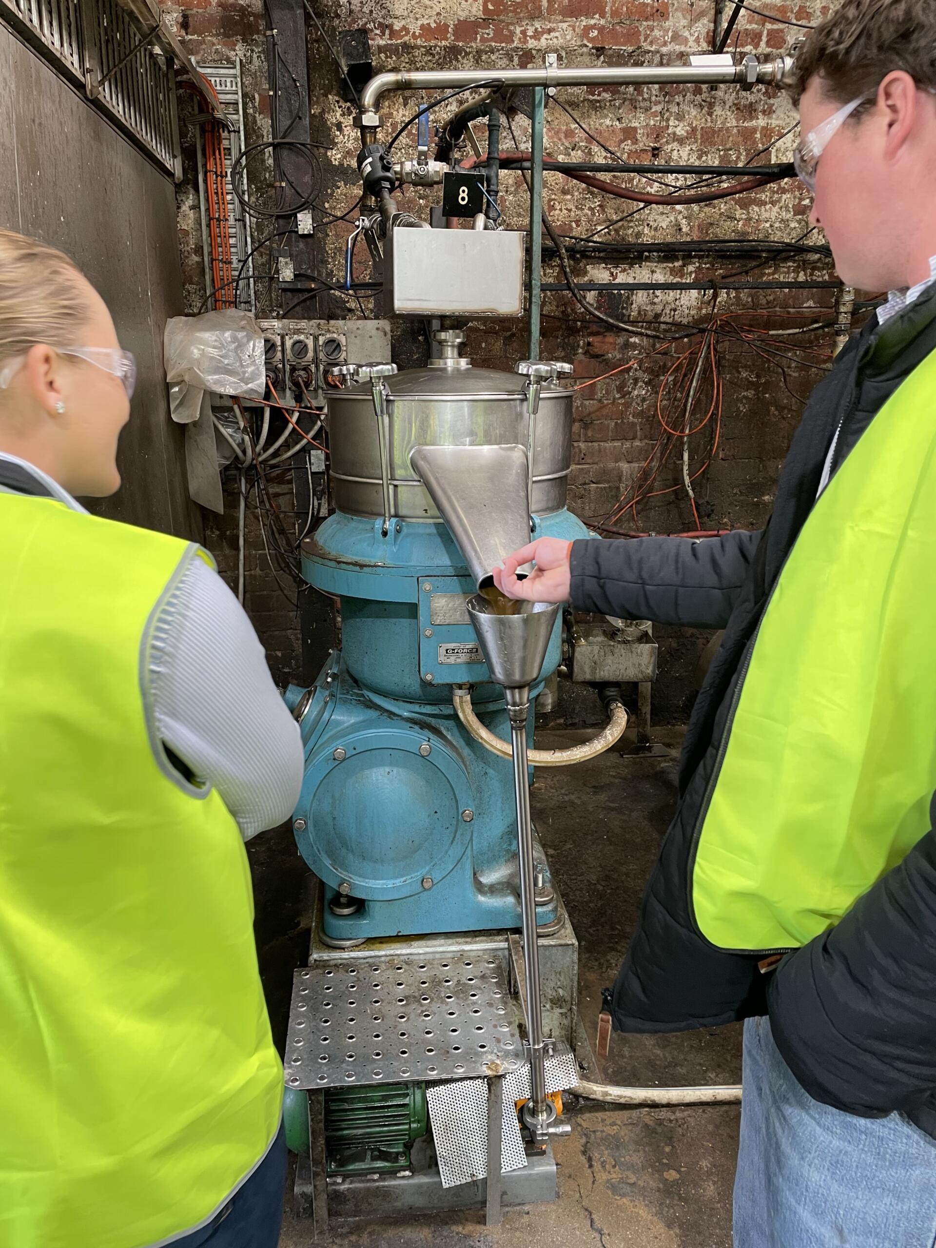 Inspecting Lanolin At The Carbonising Plant